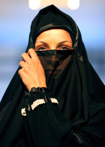 An Iranian model presents the latest Islamic fashion for women at a fashion show