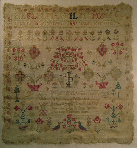 Early 19th century sewing sampler stitched by Elizabeth Lyle when a young girl.  The text in the center reads,"Elizabeth Lyle worked this in the eleventh year of my age. In the morning think what you have to do. And at night ask yourself what you have done." 